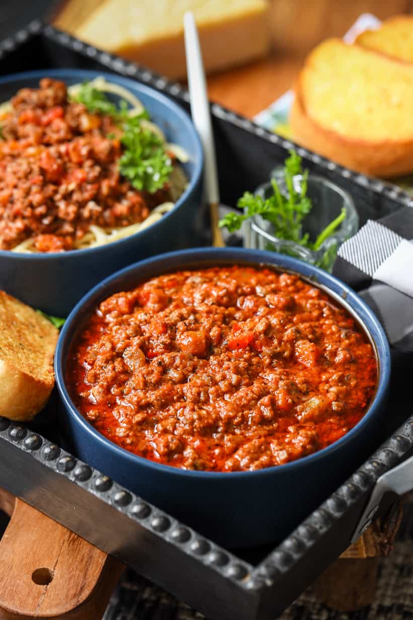 beef bolognese sauce in blue bowl