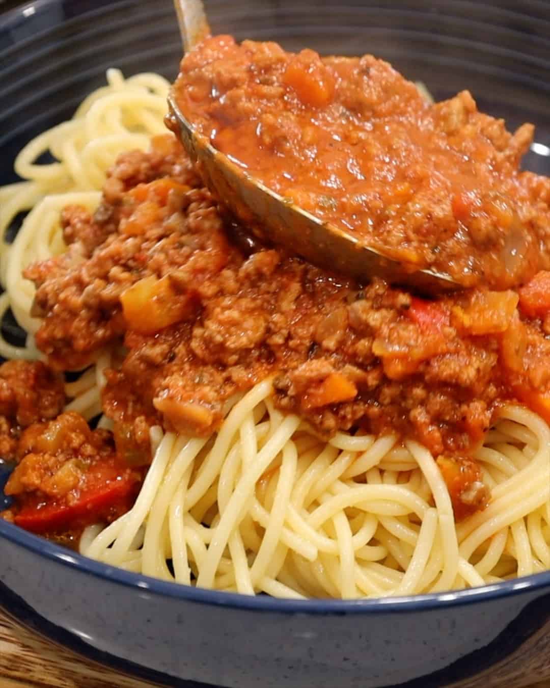 SPAGHETTI TOPPED WITH BEEF BOLOGNESE